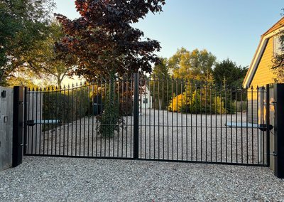 Black metal driveway gates with automation